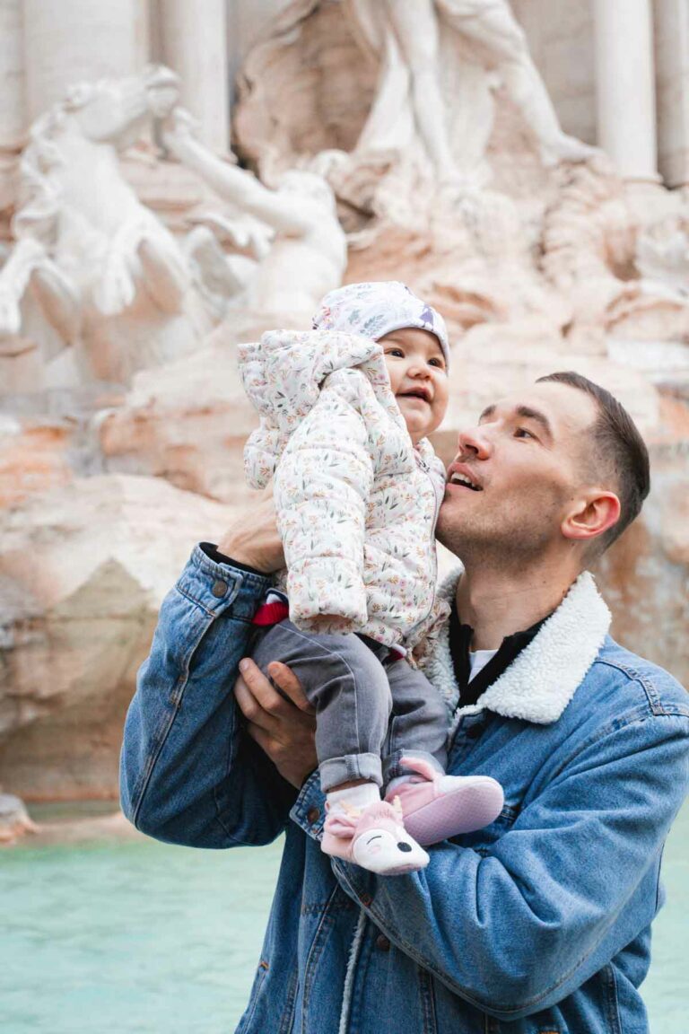 Father holding her baby at Fontana di Trevi