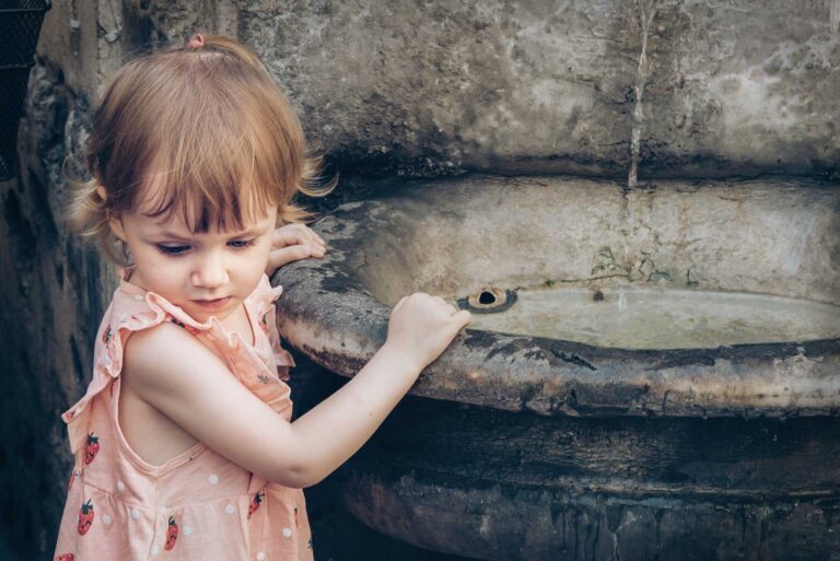 Fountain with little girl in Rome